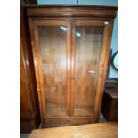 A period style full height display cabinet enclosed by 2 doors