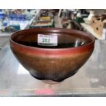 A Chinese stoneware rice bowl with high temperature brown lustre glaze fading to black, d 12cm
