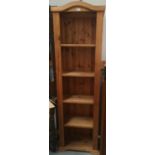 A modern pine tall bookcase