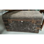 A dome top cabin trunk; a old metal trunk