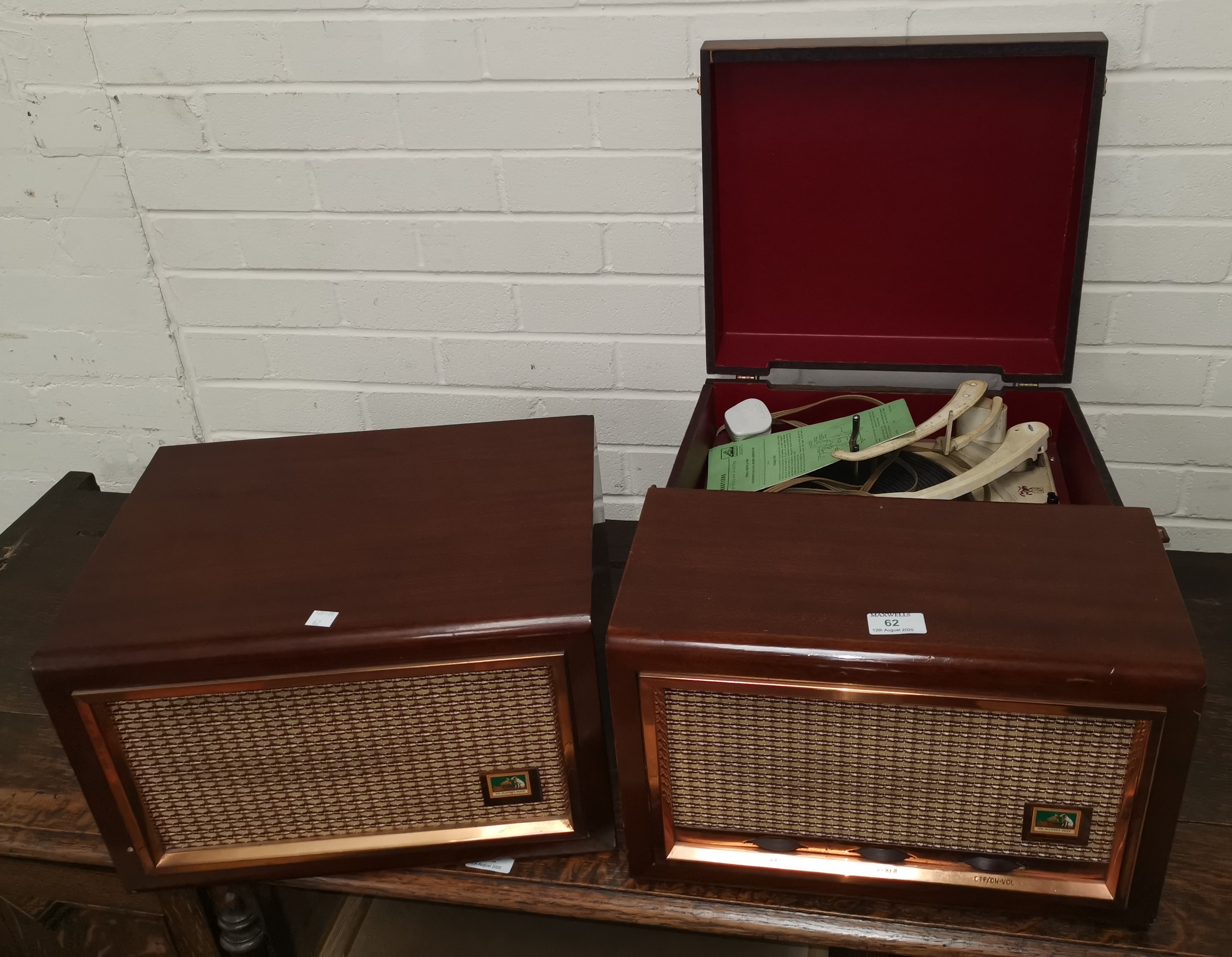 A 1950's table top record player by HMV, in mahogany case, and matching speaker