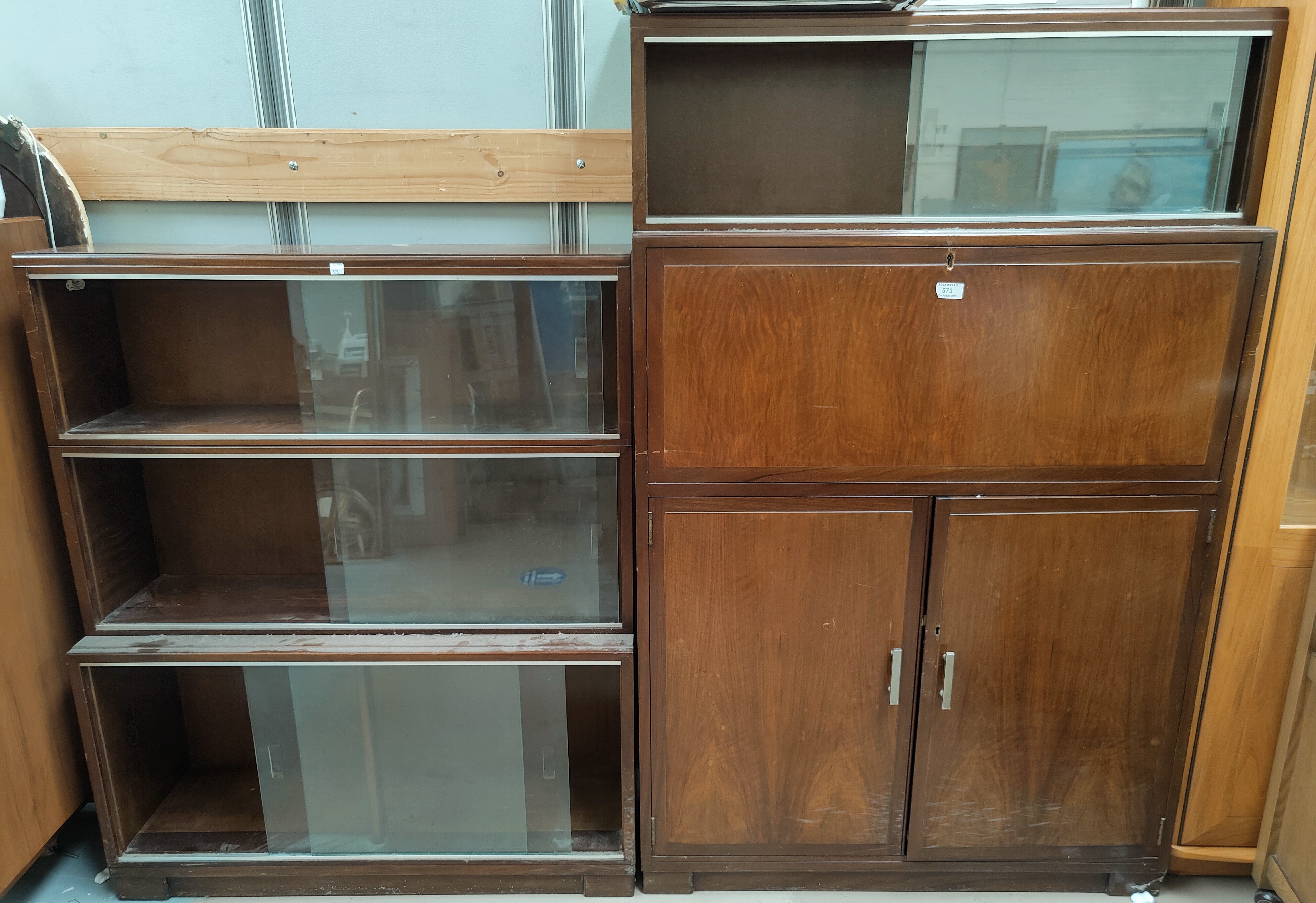 A 1960's walnut sectional secretaire cabinet and matching bookcase
