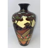 A modern Moorcroft vase of tapering form, decorated with a landscape, cottages and trees by Sian
