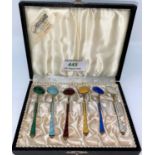 A cased set of six Danish gilded and individually coloured enamel coffee spoons stamped Denmark