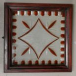 A cut and stained glass window panel with floral motif, in mahogany frame, 34 cm square