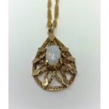 A modern 9 carat pendant, teardrop shaped, set opal coloured stone, on chain
