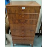 A 1930's walnut music cabinet with 8 drawers