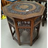 A Far Eastern occasional table with brass inlaid octagonal top