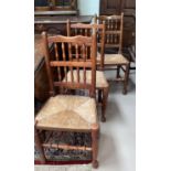 A 19th century set of 7 Lancashire dining chairs in oak and elm with spindle backs and rush seats