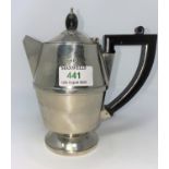 An Art Deco hall marked silver barrel shaped coffee pot/hot water jug on raised foot Birmingham 1931