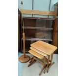 A teak and brass standard lamp; a nest of vintage tables