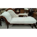 A Victorian mahogany single scroll end acanthus carved chaise longue in deeply buttoned cream