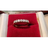 An 18 carat gold half eternity ring set 7 diamonds, 2.3 gm