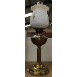 A reproduction brass oil lamp with shade; a brass jam pan; a pair of open barley twist candlesticks;