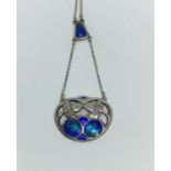 An Art & Crafts silver and enamel pendant necklace on chain, the stylised drop pendant with blue /