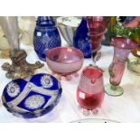 2 blue overlaid glass decanters; 4 pieces of cranberry glass; an iridescent glass vase on silver
