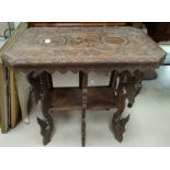 An oriental 2 tier occasional table with rectangular carved and canted top
