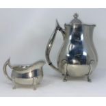 An art Nouveau Norwegian silver coffee pot and creamer designed by David Anderson, marked D A