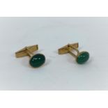 A 9 carat hallmarked gold pair of cufflinks set green cabochon stones, 6.5 gm