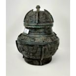 A Chinese bronze lidded vase with extensive geometric decoration, height 30cm