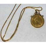 A QEII sovereign 1973, in 9 carat hallmarked gold clip mount, on 9 carat hallmarked gold box