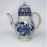 An 18th century pearlware baluster coffee pot decorated in blue & white (lid rim chipped)
