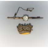A gem set bar brooch, stamped '9ct'; a seed pearl set crown brooch, 6.6 gm gross