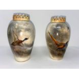 A Royal Worcester pair of baluster vases with pierced and gilded rims, hand painted with pheasant