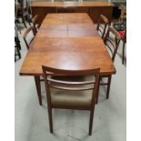 A 1960's walnut / teak dining suite comprising table with extending rectangular top, 5 ladderback