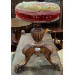 A Victorian stained walnut piano stool with revolving top; a cream standard lamp