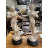An Art Nouveau pair of spelter figures of young women: "Hesitation" & "A Travers l'Espace",