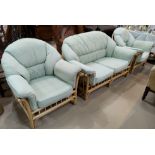 A lightwood bamboo conservatory suite in green stripe, comprising 2 seater settee, pair of armchairs