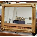 A gilt framed rectangular wall mirror with accanthus corner mounts 97cm x 79 cm A pair of table