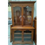 A 1930's oak bookcase with double glazed cupboard above below, w 114 x h 210cm