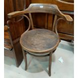 A 1930's bentwood office armchair; a beaded oak 1930's oak chiming granddaughter clock