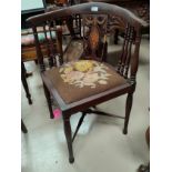 An Edwardian inlaid mahogany corner armchair