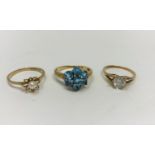 Two 9 carat hallmarked gold gem set dress rings; a similar ring stamped '9c', 5.2 gm gross