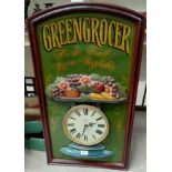 A retro 'Greengrocer' kitchen clock in painted wood surround, 83 x 45cm
