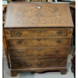 A reproduction fall front bureau in crossbanded burr walnut, with fitted interior and 4 drawers