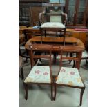 A set of 7 (6 + 1) Regency style mahogany dining chairs with seats upholstered in cream and floral