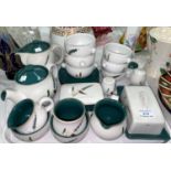 A selection of Denby Greenwheat stoneware: teapot; butter dish; soup cups; etc.