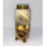 A Royal Worcester cylindrical vase with pierced gilded rim and 4 scroll feet, hand painted with