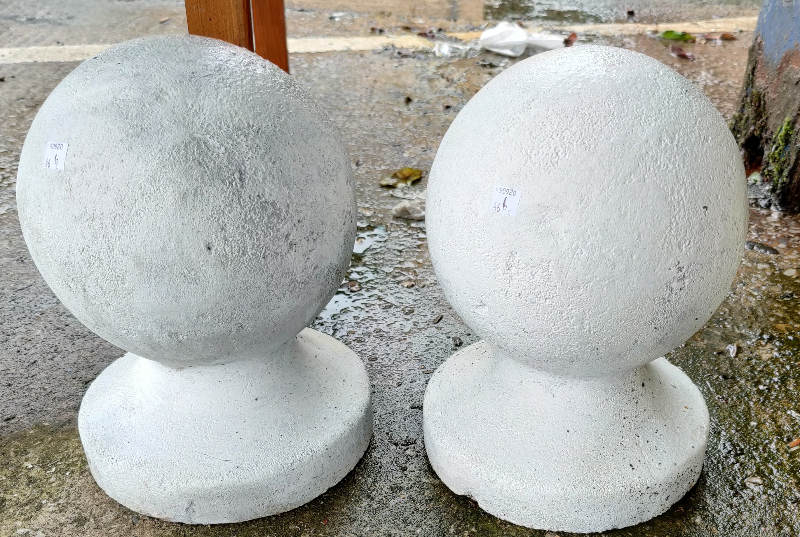 A pair of gate post ball finials