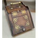 An Edwardian slope front mahogany coal box with brass mounts