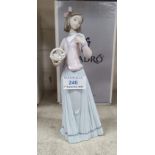 A Lladro Society bisque figure: girl with basket of flowers, height 25 cm