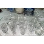 Four decanters; a selection of cut drinking glasses