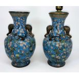 A pair of Chinese cloisonne vases with animal head handles, blue ground decorated with birds and
