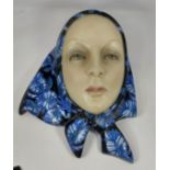 A 1930's Lenci wall mask -female face in blue floral scarf, number 561, signed Lenci Torino Italy,