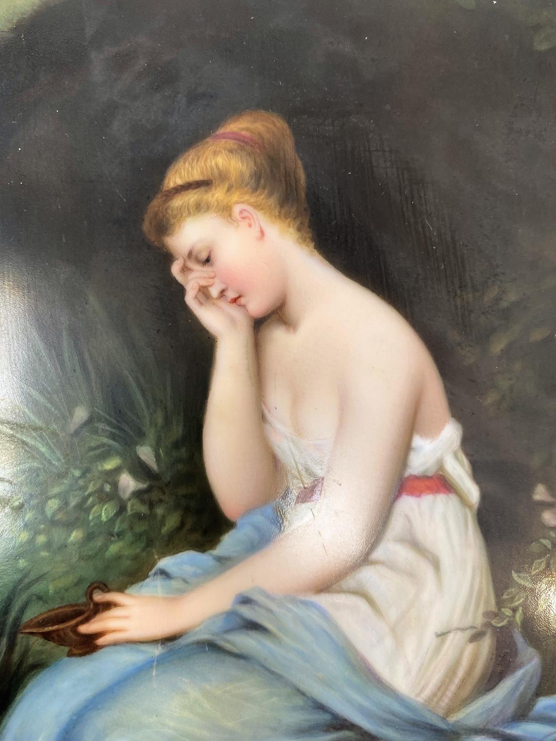 A 19th century ceramic rectangular plaque depicting a young woman seated by a woodland pond, - Image 2 of 3