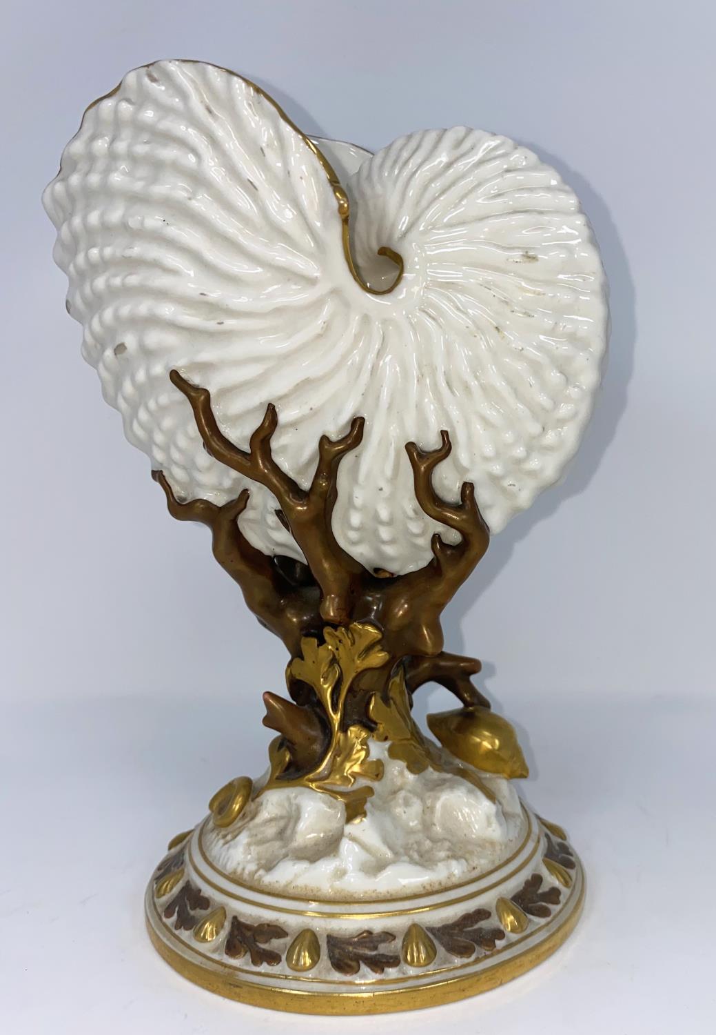 A Royal Worcester nautilus shell vase in gilded naturalistic colour, on circular base, height 22